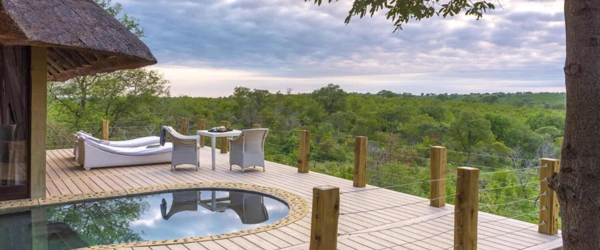 Leopard Hills Lodge private pool deck with sun loungers and views across the pristine African bushveld.