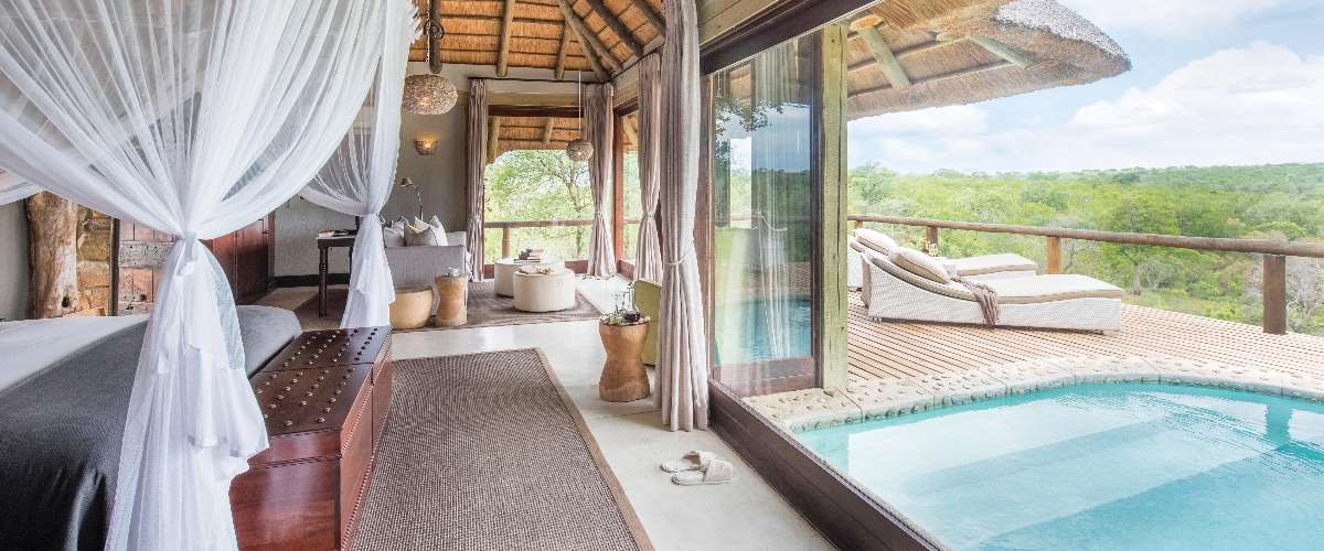 Spacious glass-fronted suite at Leopard Hills Lodge with sun deck, plunge pool, and panoramic bush views.