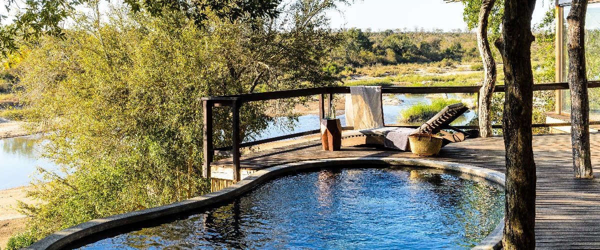 Open-air deck with private pool and panoramic views of river and the surrounding wilderness.